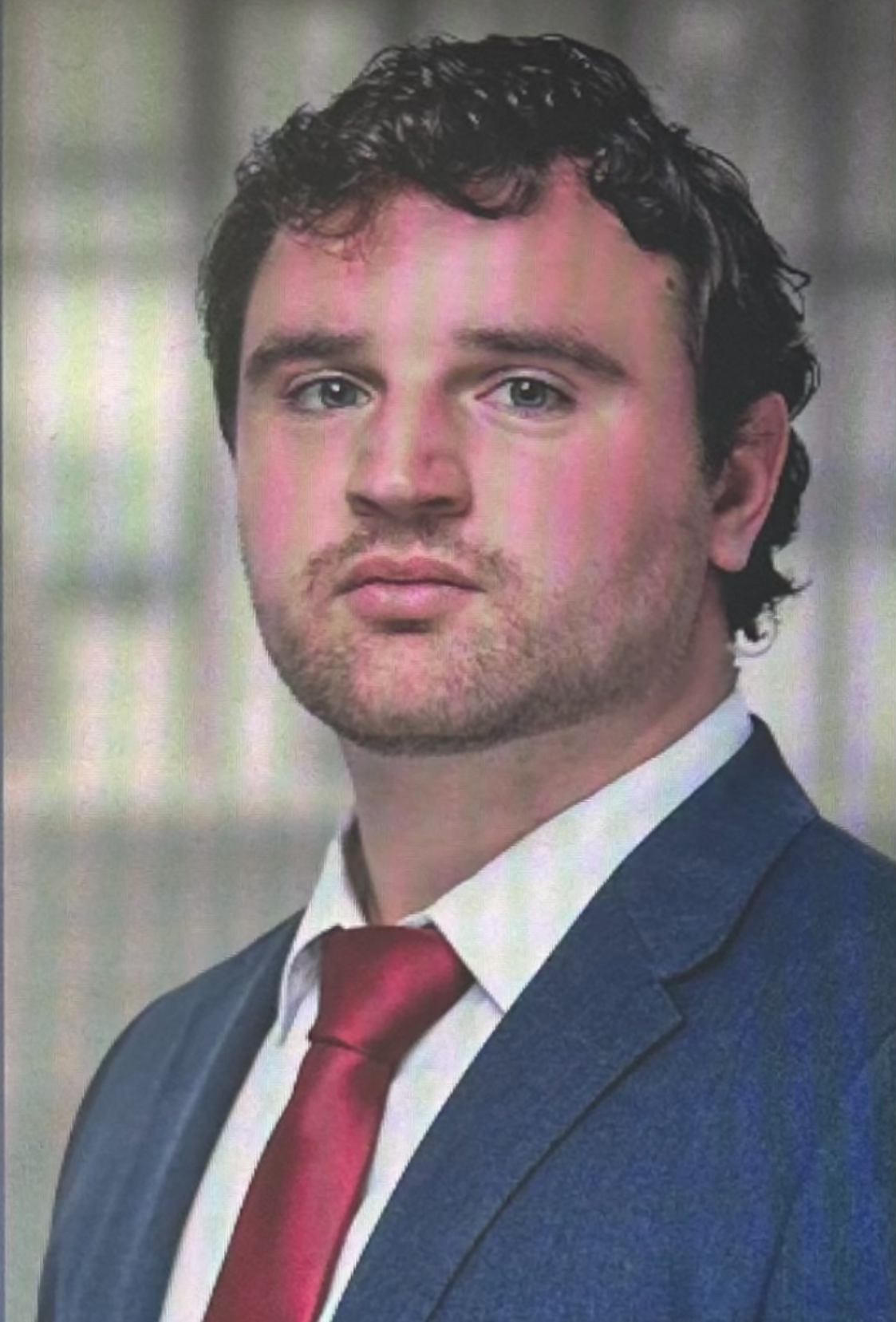 A professional headshot of John A. Longo, a criminal defense attorney.